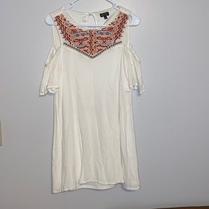 White mini skirt dress with off the shoulder shoulders